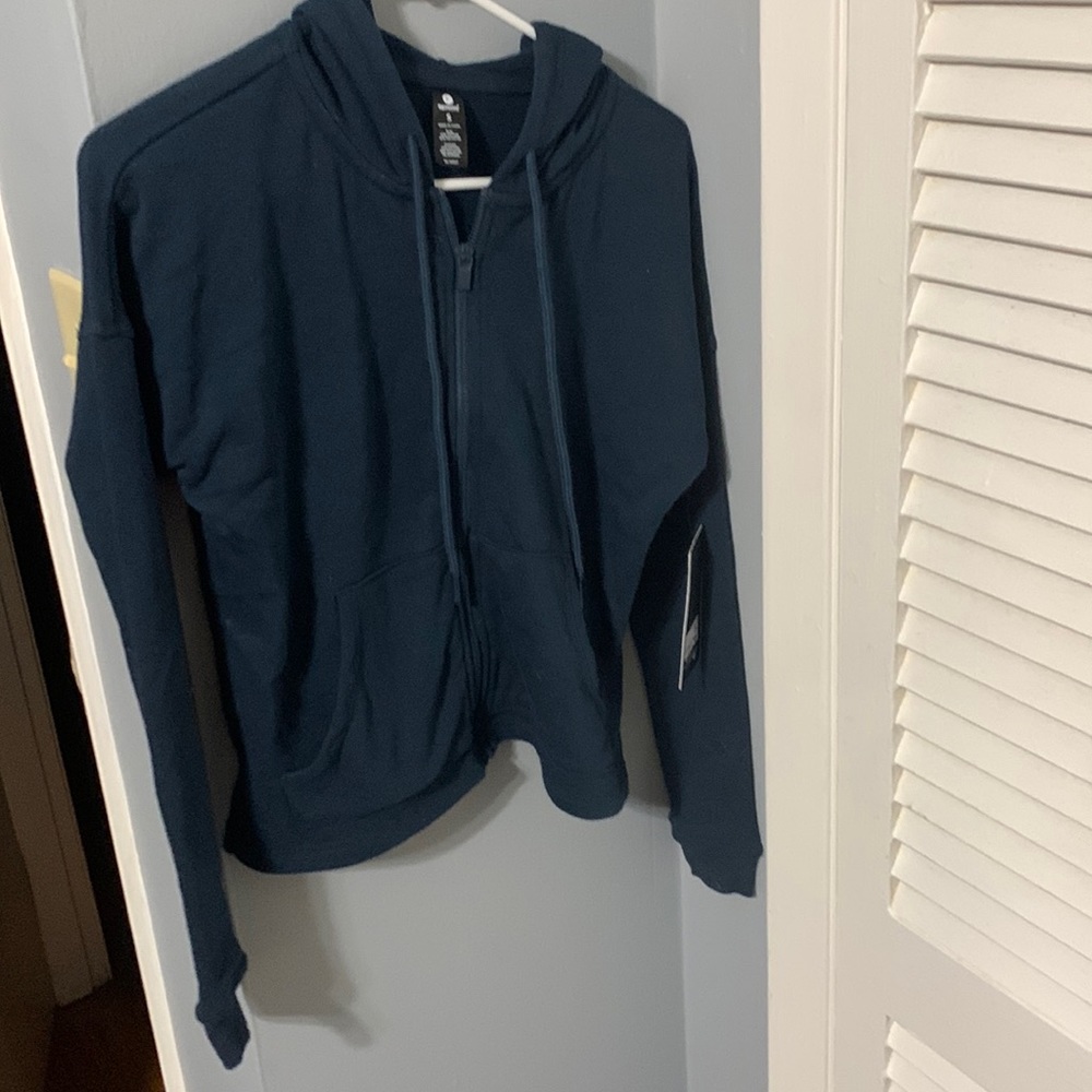 Junior women’s zip up hoodie. New with tags.
